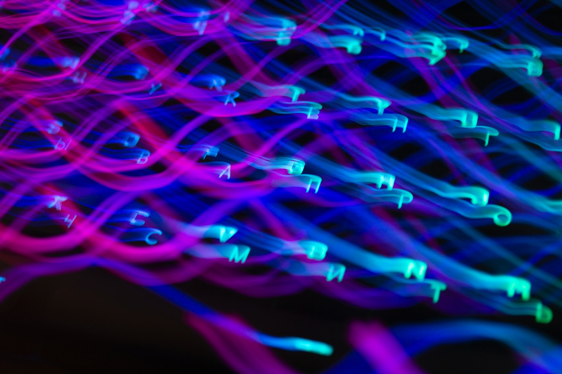 Swirling pattern of neon letters